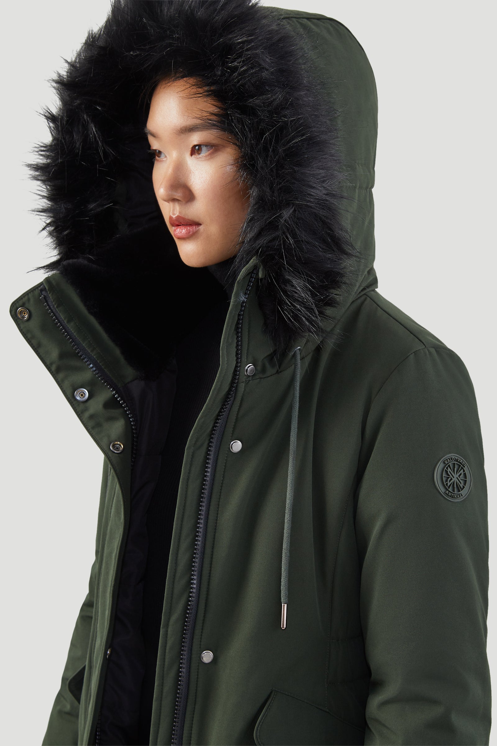Green parka black fur hood top